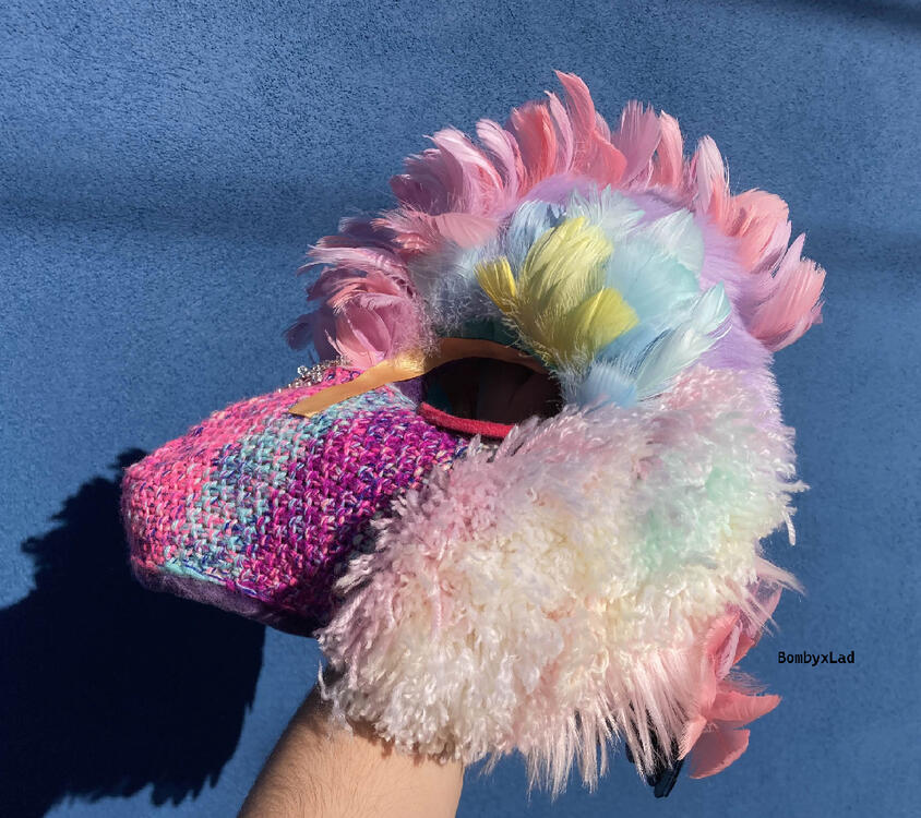 pangolin head side, being held in a hand