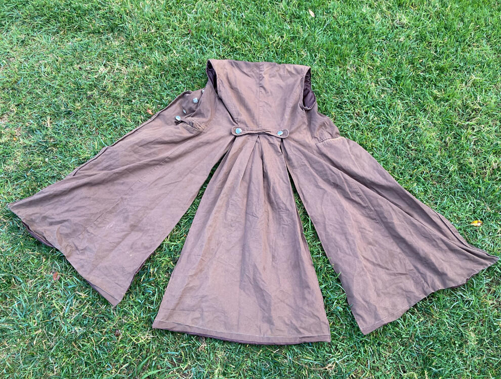 Brown coat with sits down the back